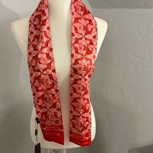 Red reversible Louis Vuitton scarf.